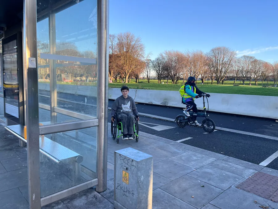 image showing wheelchair user and cyclist at intersecting cycle lane